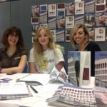 Photo of 3 women at a stand at the UWE volunteer fair