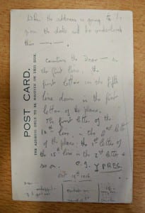 Photo of the back of a postcard with hand written notes on it