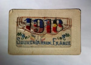 Photo of a silk postcard with '1918 Souvenir from France' embroidered on it