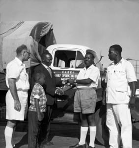Handing over keys to a new truck driver: publicity photograph from the East African Railways and Harbours Administration, Kenya, c1960