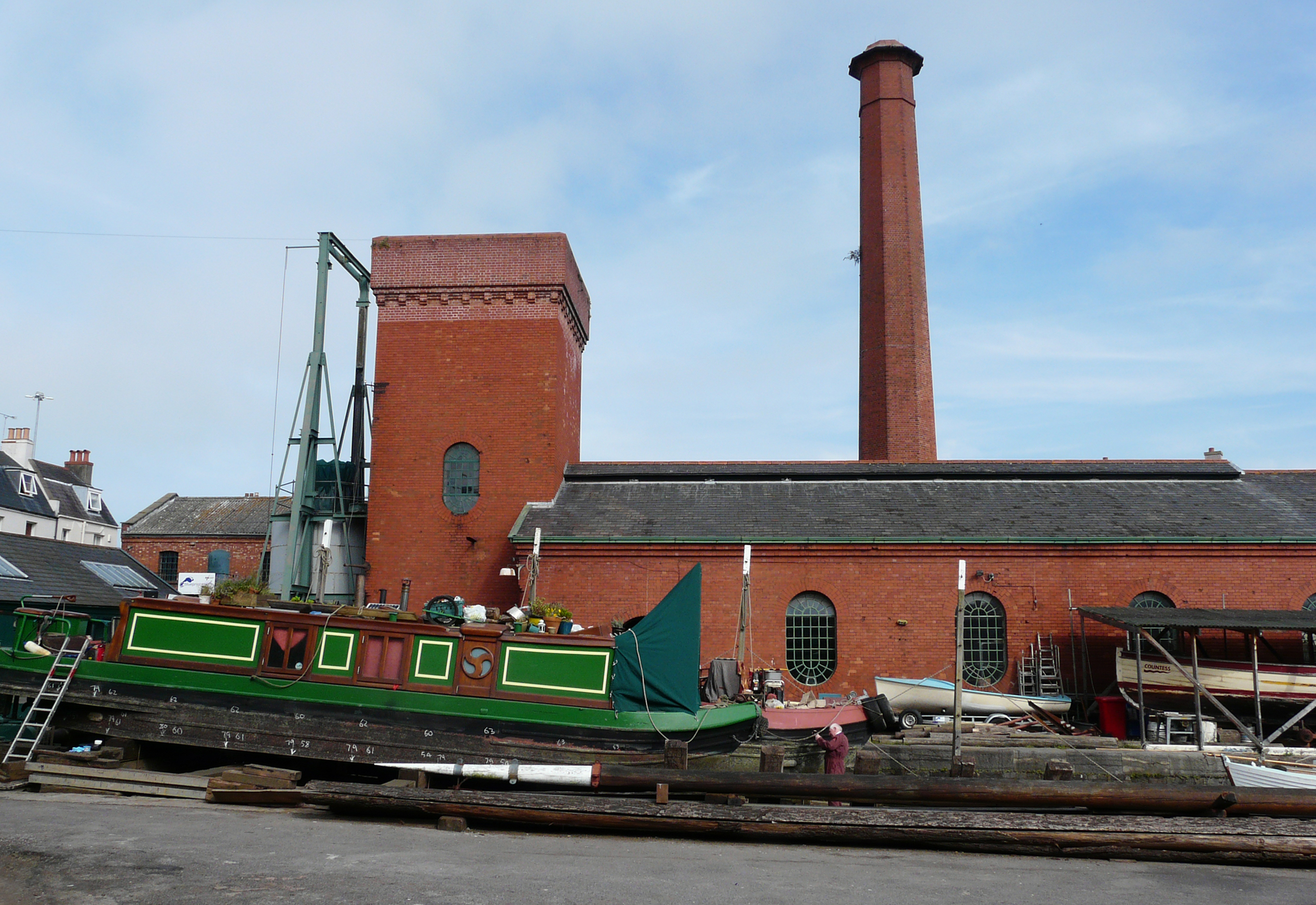 The hydraulic accumulator and engine house at Underfall Yard, with a narrow boat on the patent slip, 2014. 