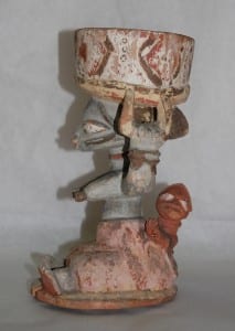 Photo of a figure holding a divination bowl
