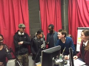The culture vultures team in the Ujima fm studio learning about radio production