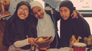 Group of smiling girls at last years Somali Family Fun Day. 