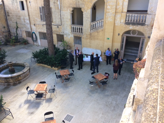 Symposium delegates in the courtyard during lunch
