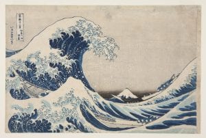 A Japanese print featuring a wave cresting