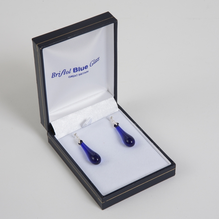 2 Bristol blue glass earrings placed in a white box