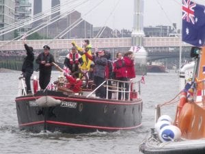 The Pyronaut. Boat full of people sails on the Thames.