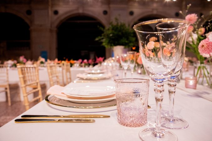 A table set up for a wedding with flowers.