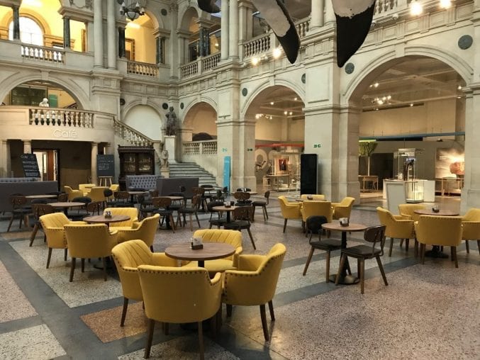 The Rear Hall of Bristol Museum & Art Gallery laid out with comfortable chairs and small tables