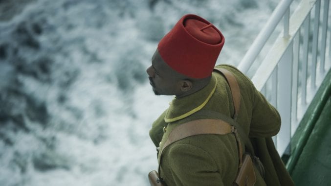 A Black soldier looking out over the ocean