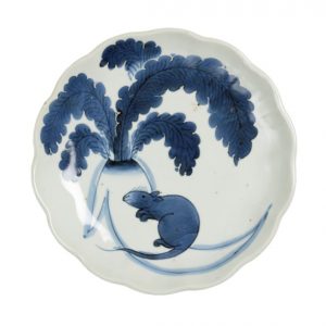 White porcelain plate with a blue painted rat and radish