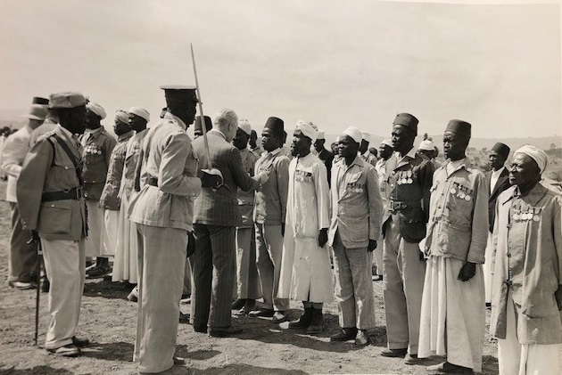 Lt Col C. G. Larking inspecting a parade of veterans in Uganda, January 1949 (from BECC 2003/212/1/5)